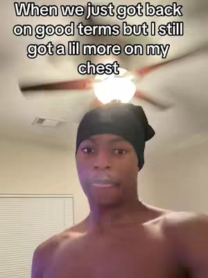 A shirtless Black man with a black cap is looking at the camera with a serious expression. Text overlays the top of the image.