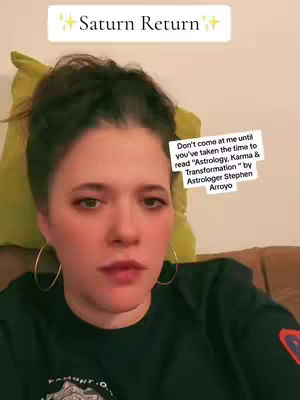 A woman with dark hair and hoop earrings looks directly at the camera. Text overlays are positioned above her head and to the side, including the title "Saturn Return" and a quote about a book.
