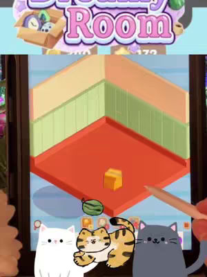 The cover image shows a phone displaying a game interface. Inside, a cartoon room is being digitally constructed. In the foreground, three animated cats are positioned.