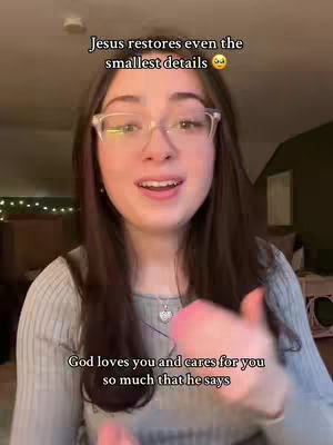 A young woman with long, brown hair and glasses is centered in the frame. Text overlays her, with the top line stating the encouragement. She is wearing a gray knit sweater and a delicate necklace. Soft lighting suggests an indoor setting.