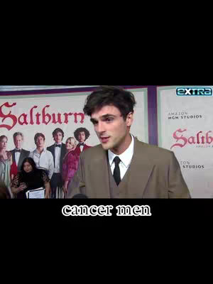 A man in a suit is speaking, the background is a event, and there is text overlay at the bottom that says "cancer men".