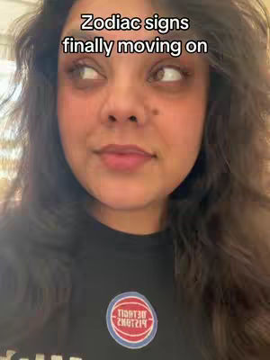 A medium shot of a woman looking slightly to the side with text overlaying the image.