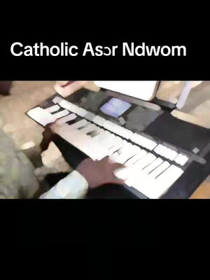 The cover image shows a person's hand playing a keyboard, with the keys and hand in focus. The top part of the image has the text overlay, and it is set against a dark background.