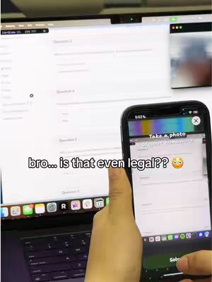 A person is holding a smartphone in front of a laptop. The smartphone screen displays a screenshot of homework with a 'take a photo' prompt. The laptop screen displays what appears to be a webpage with questions and text fields. The text overlay on the image reads, 'bro… is that even legal??' and an emoji with concerned expression.