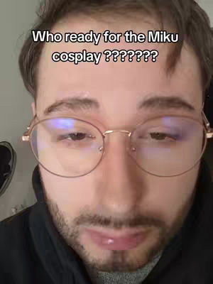The cover image features a close-up of a man's face wearing glasses. Text overlayed at the top reads, "Who ready for the Miku cosplay ???????". The man's expression is neutral, with a slight look in his eyes.