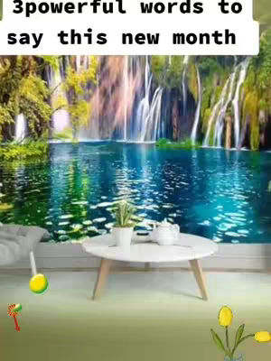 The image is a serene indoor scene featuring a white table and a plant in front of a large, scenic backdrop depicting a waterfall and a lake. The lighting is natural and soft, with colors that include greens, blues, and whites.