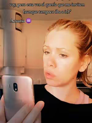 A woman with red hair and a black top looks at her phone, with text and a zodiac symbol overlaid in the background.