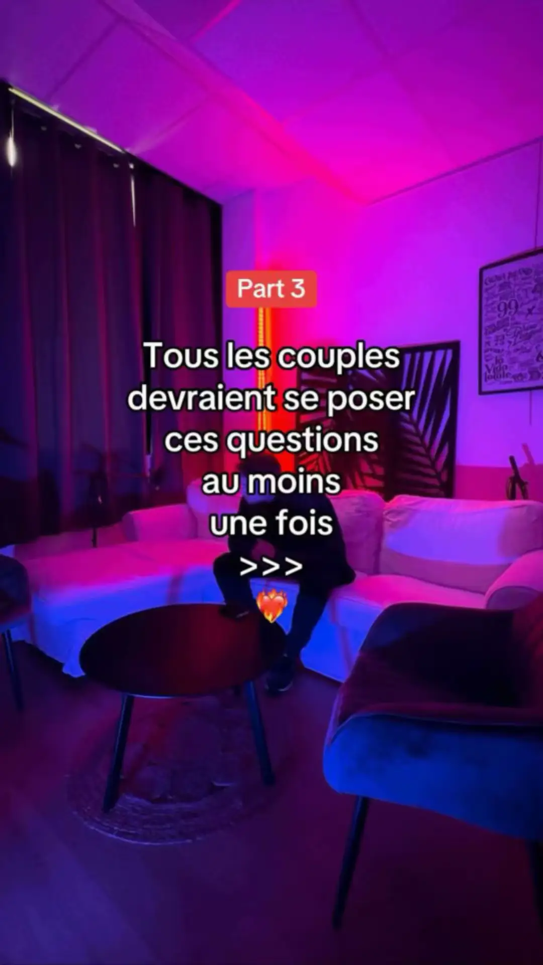 The cover image is a dimly lit interior scene with a sofa, a table, and chairs. The walls are colored with a mix of pink and purple lights. Text overlays are present. The overall composition creates an intimate and mood.