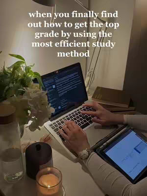 The image shows a well-lit workspace with a laptop, tablet, and accessories. In the foreground, hands are seen typing on a laptop keyboard, with a tablet and a watch on the wrist visible. There is a book and plants arranged around the workspace, giving it a comfortable feel. The text overlay provides context.