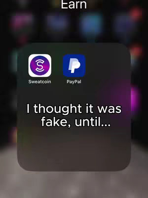 The cover image shows a blurred background with a dark, rounded rectangle, holding two app icons: Sweatcoin (purple and white) and PayPal (blue and white). Below the apps is a white text overlay reading, “I thought it was fake, until…”. The icons are prominent, set against a generally dark tone with hints of color in the background.