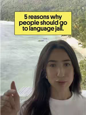 A woman with long dark hair giving a thumbs-up in front of a beach backdrop. A yellow rectangular graphic hovers above her head with the text "5 reasons why people should go to language jail." The overall composition is bright and inviting.