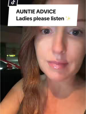 A close-up shot of a woman's face. She has fair skin, reddish hair, and is wearing a top. The background is out of focus, but appears to be a car interior or similar setting. A text overlay at the top indicates it is Auntie Advice.
