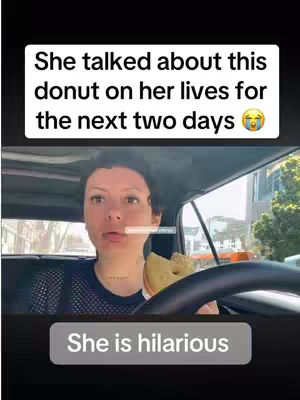 A woman is inside a car, holding a donut. Text overlays indicate the video is about the donut.