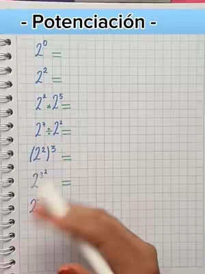 A hand with a white pen is writing math equations on a grid paper notebook. The top of the page has the title "- Potenciación -" in a blue text box.