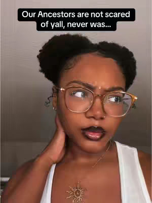 A close-up of a Black woman looking to the side with a contemplative expression. She wears glasses and a white tank top. Text overlays the image.