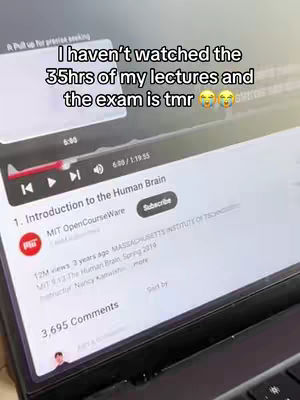 A laptop displays a YouTube video titled "Introduction to the Human Brain." Overlaid text humorously expresses the creator's study procrastination.
