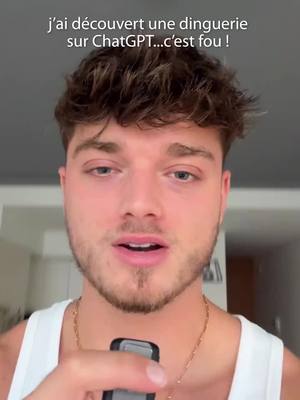 A young man, framed from the chest up, looks directly at the camera. The man has short, styled brown hair and stubble. He wears a white tank top and a gold chain. A phone is held in his hands, close to his chest. The background appears to be an indoor residential setting. The text overlay at the top of the image, in white font, states, "J'ai découvert une dinguerie sur ChatGPT...c'est fou !"