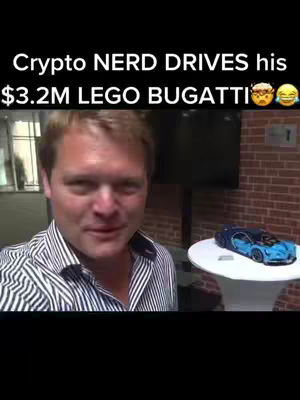 A man in a striped shirt stands indoors with a LEGO Bugatti and a blurred display screen behind him. Text overlay indicates the theme.