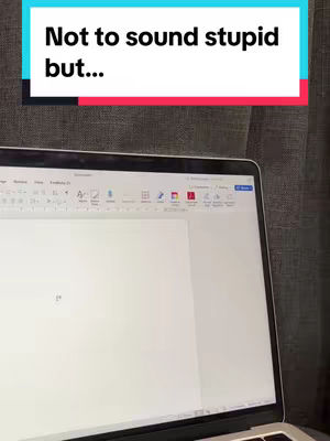 A laptop screen displays a document; overlaid text appears in a colored bar; the background is a textured surface.