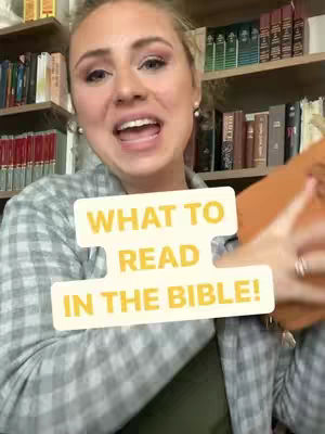 A woman with blonde hair and makeup is in the foreground, holding a book and speaking. A white and yellow graphic that says "WHAT TO READ IN THE BIBLE!" is overlaid on her torso. Shelves filled with books are visible in the background and on the sides.