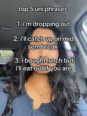 A selfie-style video cover image. A young woman with long, dark hair is in the center, her face taking up most of the frame. She's wearing a blue top and a necklace. The image is taken from inside a vehicle looking outward. The background is blurred due to the proximity of the subject. Overlaid text lists 'top 5 uni phrases'.