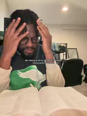 A person, likely the creator, is sitting, looking down with a concerned expression, hands on head, facing a book. The setting suggests a home or office. A text overlay is present. The overall tonality suggests introspection or frustration.