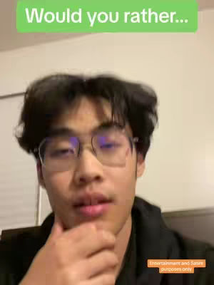 A young man with black hair and glasses is looking at the camera with a slight smile, with an overlay in the upper portion of the image.