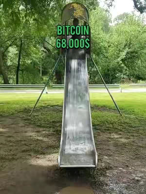 An outdoor shot of a metal slide, with the text overlayed at the top. The slide is in a park setting with trees and grass in the background. The text says "Bitcoin 68,000$".