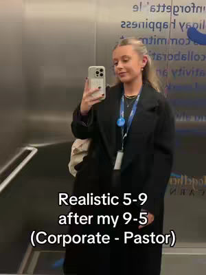 A woman takes a selfie in a metallic elevator, holding her phone up to the mirror. She's wearing a black coat, and the text overlay at the bottom reads \"Realistic 5-9 after my 9-5 (Corporate - Pastor)\".