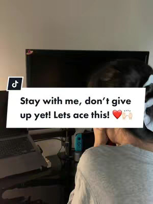 An interior shot with a person facing away from the camera, their head rested on their arm, appearing tired. A laptop, a gaming console, and a television are also in the background. A text overlay provides motivational text inside a white rounded rectangle.