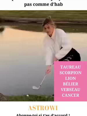 A woman is shown about to hit a golf ball. The woman is wearing a white sweater, black pants, and is situated next to a body of water. A pink rectangle with text about the astrological signs is placed at the right.