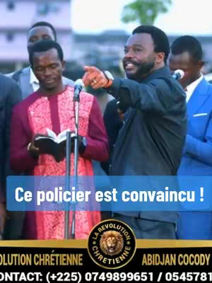The image captures a religious gathering. Several men are present; one in the foreground is pointing and speaking, while others observe quietly. A blue banner displays overlaid text, and a logo is at the bottom indicating an organization based in Abidjan, Cocody, Ivory Coast.