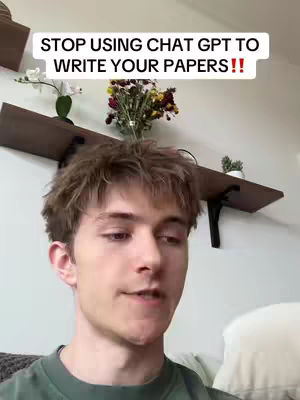 A young man with short brown hair is centered in the frame, talking directly to the camera. Above him, a shelf holds flowers. The background is a light-toned setting with a warm, inviting feel. A text overlay at the top, set in a bold, white font, delivers the hook of the video.