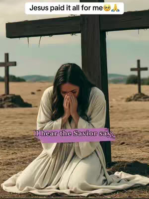 The cover image shows a woman in a white robe kneeling in prayer with her hands clasped in front of her face. She is positioned in front of a large wooden cross, with two other crosses visible in the background. The setting appears to be a field during the day, and the overall tone is one of reverence and faith.
