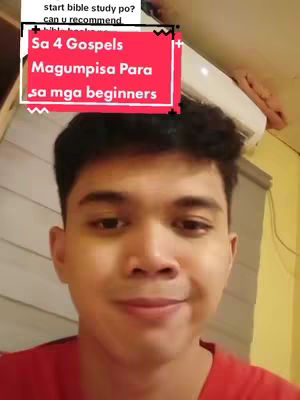 A man with short black hair smiles at the camera. Overlaid on the image is a red rectangular box containing white text, above which is slightly visible some text in the top left corner.