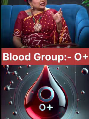 The image displays a woman in a red saree seated on a blue couch, with an overlaid graphic of a blood drop and text reading 'Blood Group:- O+'. The background shows an abstract scientific illustration.