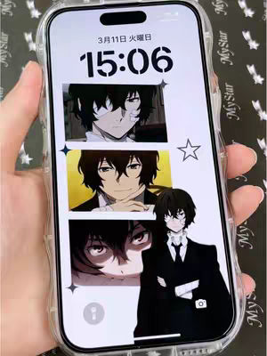 A person's hand holding a smartphone displaying a lock screen. The lock screen features anime art of different characters from the anime series 'Bungo Stray Dogs.' The background has a simple star and a date and time display at the top.